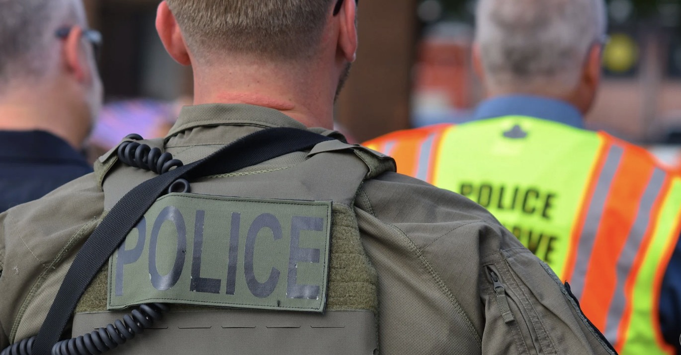Police officers in tactical gear during a public operation